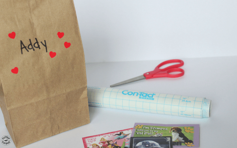 The only supplies you need to make Valentine's Day placemats is contact paper and your kids valentines cards from school.
