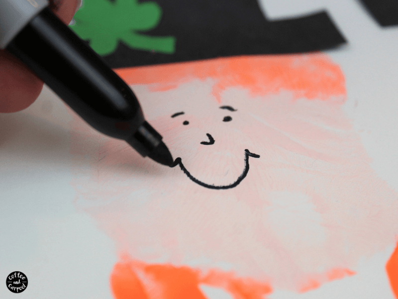 This leprechaun handprint craft is the perfect St. Patrick's Day craft for kids since it measures their small little hand. #stpatricksday #stpatricksdaycrafts #leprechaun #handprintcraft #handrpintart #coffeeandcarpool 