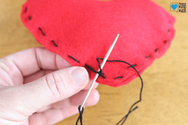 Then continue to sew the two hearts together. 
